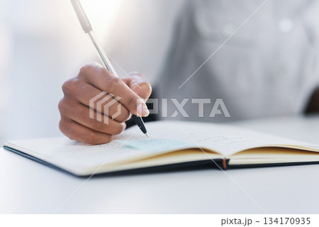 Hand, pen and writing in notebook or planning, working and notes in journal, book or record for study or research. Person, write and closeup on work, communication or reminder and paper for school 134170935