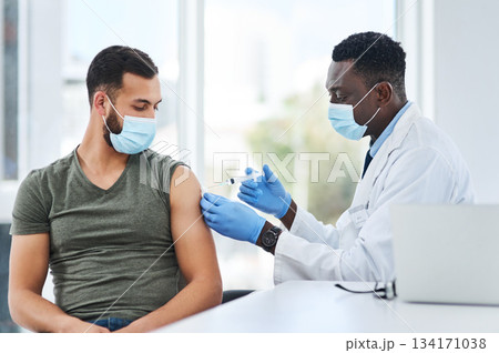 Covid, vaccine and man doctor with syringe in healthcare consultation for safety or prevention. Corona, vaccination and arm injection for guy person by physician in face mask for hospital compliance Covid, vaccine and man doctor with syringe in healthcare consultation for safety or prevention. Corona, vaccination and arm injection for guy person by physician in face mask for hospital compliance 134171038