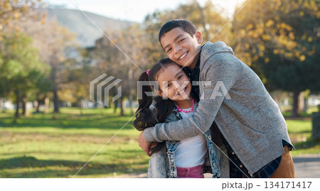 Park, hug and portrait of brother and sister enjoying summer day for bonding, quality time and playing. Family, children and happy siblings hugging, embrace and loving in nature for relaxing together Park, hug and portrait of brother and sister enjoying summer day for bonding, quality time and playing. Family, children and happy siblings hugging, embrace and loving in nature for relaxing together 134171417