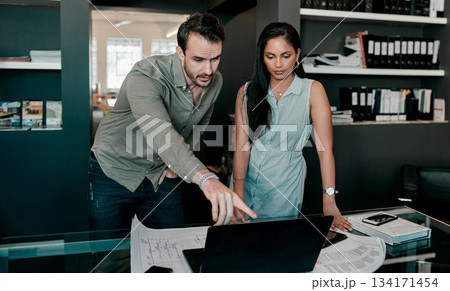 Laptop, people with construction paper of plan on desk and architecture in modern office. Engineering, teamwork or collaboration at work and coworkers planning or development with blueprint. 134171454