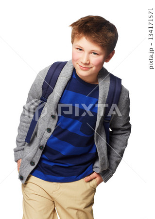 Happy boy, school and portrait smile standing with hands in his pockets, cool or style isolated on a white background. Young little child or kid student posing with backpack for learning or education Happy boy, school and portrait smile standing with hands in his pockets, cool or style isolated on a white background. Young little child or kid student posing with backpack for learning or education 134171571