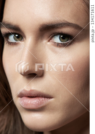 Skincare, closeup and beauty or portrait of a woman with clean facial cosmetics for spa and self care. Makeup, natural face and model person or skin glow treatment or anti aging and eyeliner Skincare, closeup and beauty or portrait of a woman with clean facial cosmetics for spa and self care. Makeup, natural face and model person or skin glow treatment or anti aging and eyeliner 134171611