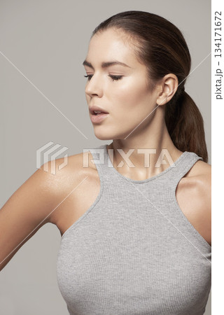 Beauty, close up and style or young woman in natural facial cosmetics and against a grey background. Makeup, glow and beautiful woman model or healthy skin or clean face and fashion in studio Beauty, close up and style or young woman in natural facial cosmetics and against a grey background. Makeup, glow and beautiful woman model or healthy skin or clean face and fashion in studio 134171672