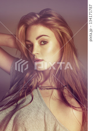 Red hair, beauty and portrait of woman in studio with natural cosmetics, makeup and glow. Confident, fashion and face of ginger, beautiful and flirting female person on blurred background with filter Red hair, beauty and portrait of woman in studio with natural cosmetics, makeup and glow. Confident, fashion and face of ginger, beautiful and flirting female person on blurred background with filter 134171787