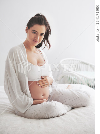Portrait, pregnant and woman on a bed, maternity leave and happiness with rest, relax and healthy. Face, female person and mother touching stomach, pregnancy and lady in a bedroom and break at home Portrait, pregnant and woman on a bed, maternity leave and happiness with rest, relax and healthy. Face, female person and mother touching stomach, pregnancy and lady in a bedroom and break at home 134171906