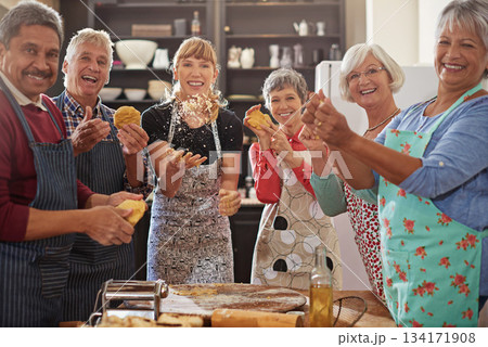 Portrait, happy senior people having fun kitchen and at cooking class. Achievement or success, baking or cooking collaboration and teamwork of elderly group cheering or celebrating together 134171908