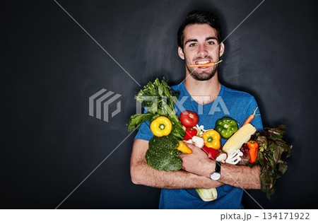 Healthy, portrait of young man with vegetables and in black background. Vegan lifestyle or nutrition, food for a diet and male person isolated in studio backdrop with groceries or ingredients 134171922