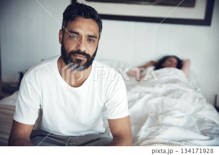 Sad, depression and portrait of a man on a bed with wife sleeping in the morning. Upset, depressed and a mature male person looking tired, frustrated or unhappy with a woman in the bedroom for sleep 134171928