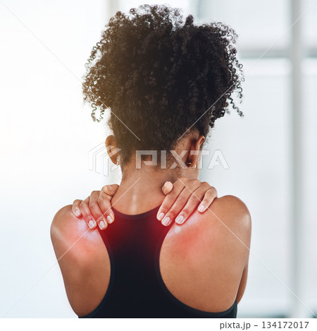 Rear view, young black woman and suffering from back pain or wearing sports bra or shoulder health and on white background. Afro, girl person and feeling hurt from gym or joint ache and fibromyalgia 134172017