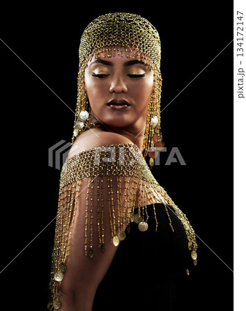 Woman, beauty and queen in studio with gold, jewelry and elegance on black background. Golden, makeup and female model pose in luxury, rich and fancy accessories with ethereal fantasy aesthetic Woman, beauty and queen in studio with gold, jewelry and elegance on black background. Golden, makeup and female model pose in luxury, rich and fancy accessories with ethereal fantasy aesthetic 134172147