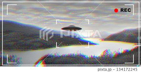 UFO, alien and camcorder viewfinder with a spaceship flying in the sky over area 51 for an invasion. Camera, spacecraft and conspiracy theory with a saucer on a display to record a sighting of aliens 134172245