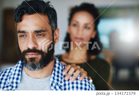 Support, sad and woman comforting a man with anxiety, depression or mental health problem. Thinking, love and a couple with care, comfort and touching shoulder for concern while depressed at home 134172379