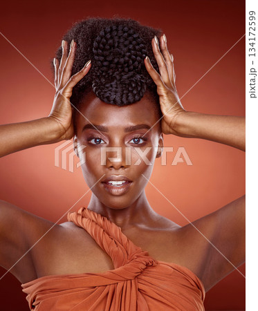 Portrait, fashion and black woman with beauty, hair style and confident girl against a red studio background. Face, female person and model with glamour, stylish outfit and wellness with culture Portrait, fashion and black woman with beauty, hair style and confident girl against a red studio background. Face, female person and model with glamour, stylish outfit and wellness with culture 134172599