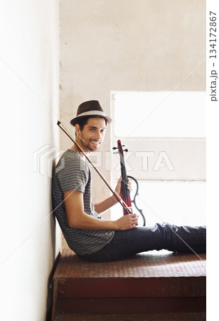 Portrait, musician and man with a violin, smile and training for a performance, sound or happiness at home. Face, male person of happy violinist with joy, creativity and instrument with entertainment Portrait, musician and man with a violin, smile and training for a performance, sound or happiness at home. Face, male person of happy violinist with joy, creativity and instrument with entertainment 134172867