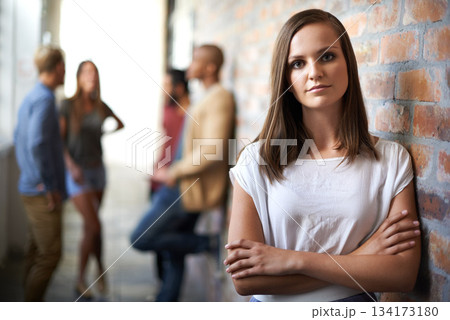 University, hallway or portrait of woman with crossed arms for education, knowledge and learning. College, academy or scholarship female student with friends in campus corridor for studying or school 134173180