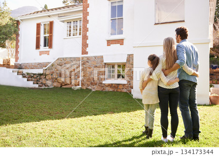 New home, love and family hug for house, real estate building and property purchase, sale or investment. Mortgage, parents and back of mother, father and child hugging for homeowner relocation 134173344