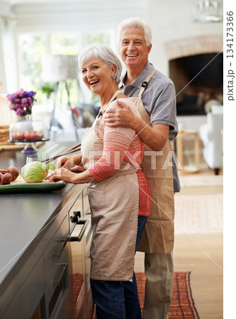 Cooking, food and portrait of old couple in kitchen for salad, love and nutrition. Happy, smile and retirement with senior man and woman cutting vegetables at home for health, dinner and recipe 134173366