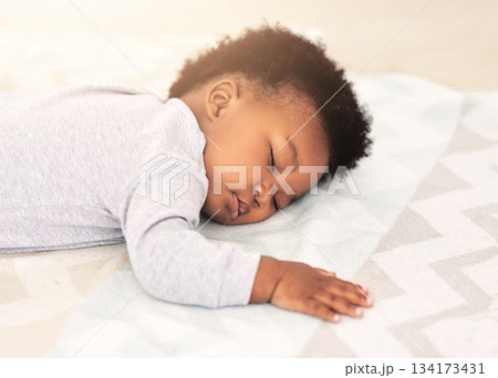 Baby, african boy and sleeping on bed for rest, health and peace for growth, development and relax in family home. Black male infant, tired and sleep in bedroom with fatigue, quiet and calm in house Baby, african boy and sleeping on bed for rest, health and peace for growth, development and relax in family home. Black male infant, tired and sleep in bedroom with fatigue, quiet and calm in house 134173431