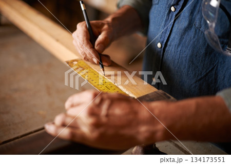 Carpentry, measurement and man hands with pencil, ruler and designer furniture manufacturing workshop. Creativity, small business and professional carpenter planning sustainable wood project design. Carpentry, measurement and man hands with pencil, ruler and designer furniture manufacturing workshop. Creativity, small business and professional carpenter planning sustainable wood project design. 134173551