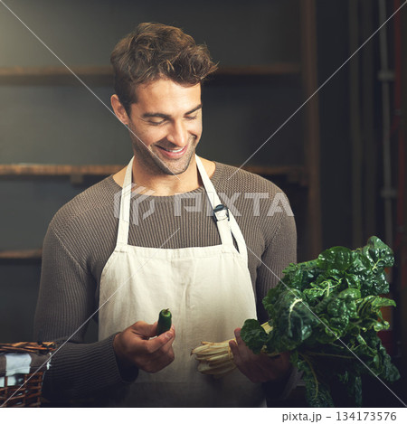 Food, happy man with vegetables and chef in kitchen in his home. Healthy or nutrition diet with spinach, ingredients or recipe and smiling male person with apron prepare green salad at his house 134173576