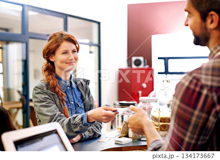 Woman smile, customer and credit card at a coffee shop for payment with a order at restaurant. Female person, happiness and diner to pay and buy at cafe with male store assistant and barista Woman smile, customer and credit card at a coffee shop for payment with a order at restaurant. Female person, happiness and diner to pay and buy at cafe with male store assistant and barista 134173667