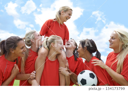 Sports, success and women soccer team winner celebrating victory, achievement or match goal on field. Football, champion and girl group lifting captain in celebration, competition or training triumph Sports, success and women soccer team winner celebrating victory, achievement or match goal on field. Football, champion and girl group lifting captain in celebration, competition or training triumph 134173799