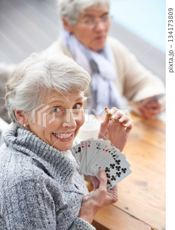 Happy, portrait and old people playing cards at a nursing home for happiness, recreation and game. Smile, showing and a senior woman with a win in poker, excited and bonding with friends in games Happy, portrait and old people playing cards at a nursing home for happiness, recreation and game. Smile, showing and a senior woman with a win in poker, excited and bonding with friends in games 134173809