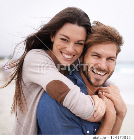 Piggyback, love and portrait of couple at a beach, hug and laughing while bonding outdoors. Face, embrace and happy man with woman at the ocean for travel, freedom or vacation, holiday or Mexico trip Piggyback, love and portrait of couple at a beach, hug and laughing while bonding outdoors. Face, embrace and happy man with woman at the ocean for travel, freedom or vacation, holiday or Mexico trip 134173816