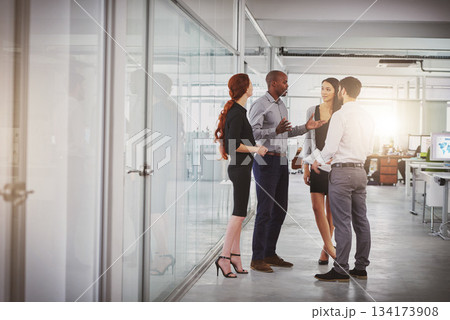 Business people, group and discussion in office hallway with men, women or diversity for strategy at startup. Businessman, leader or talking for motivation, teamwork or brainstorming for company goal Business people, group and discussion in office hallway with men, women or diversity for strategy at startup. Businessman, leader or talking for motivation, teamwork or brainstorming for company goal 134173908