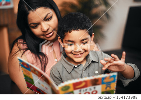 Mother, son and happy with book, learning and reading together with support, care and love in family home. Woman, boy child and teaching for education, development and life skills in house with story 134173988