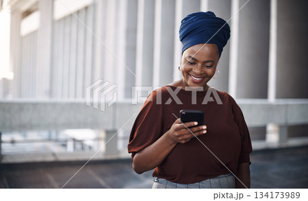 African business woman, city and texting with phone, smile and happiness for contact, chat or email notification. Female entrepreneur, smartphone and networking with excited face for communication African business woman, city and texting with phone, smile and happiness for contact, chat or email notification. Female entrepreneur, smartphone and networking with excited face for communication 134173989