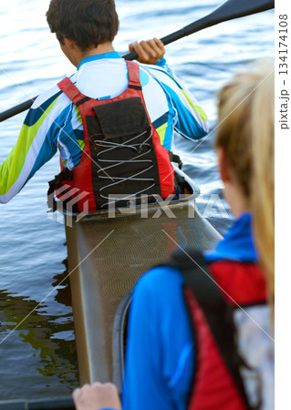 Back, man and woman on water in kayak for rowing, sport and fitness for health, wellness and teamwork. Rowing team, boat and adventure for sports, freedom and exercise on river, dam or lake in nature Back, man and woman on water in kayak for rowing, sport and fitness for health, wellness and teamwork. Rowing team, boat and adventure for sports, freedom and exercise on river, dam or lake in nature 134174108