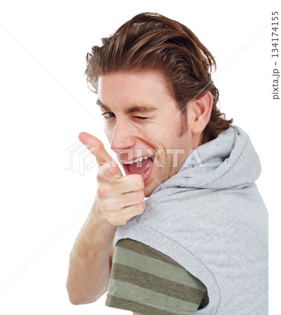 Pointing, wink and portrait of man in studio for finger gun, approval and choice. Confident, happy and smile with male and hand gesture isolated on white background for success, yes and thank you 134174155