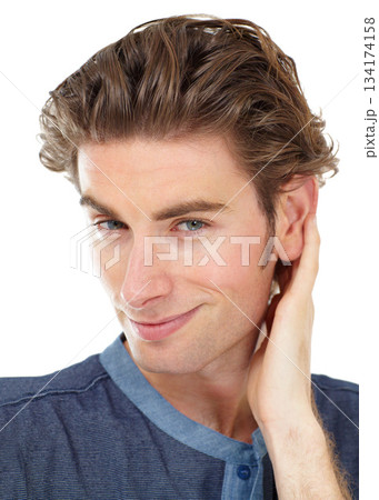 Portrait, smile and man with confidence, smirk and casual guy isolated against white studio background. Face, happy male person and model with happiness, relax and handsome with joy and flirting 134174158