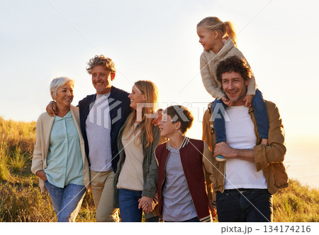 Love, countryside and family bonding, smile and quality time with happiness, walking and relax. Grandparents, mother and happy father carry daughter, siblings and loving outdoor, break and adventure Love, countryside and family bonding, smile and quality time with happiness, walking and relax. Grandparents, mother and happy father carry daughter, siblings and loving outdoor, break and adventure 134174216