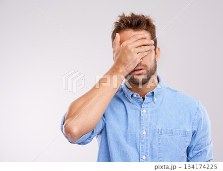 Mockup, covering eyes and man with regret, mistake and guy against a grey studio background. Male person, model or human with hand on face, frustrated and problem with an issue, upset or disappointed Mockup, covering eyes and man with regret, mistake and guy against a grey studio background. Male person, model or human with hand on face, frustrated and problem with an issue, upset or disappointed 134174225