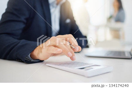 Businessman, hands and calculator for finance, budget or expense in accounting or planning at office. Hand of male accountant working on financial plan, strategy or investment of corporate expenses 134174240