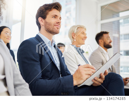 Audience, notebook and happy man writing notes of tradeshow speech, seminar presentation or convention event. Trade show attention, conference meeting or business crowd listening in training workshop Audience, notebook and happy man writing notes of tradeshow speech, seminar presentation or convention event. Trade show attention, conference meeting or business crowd listening in training workshop 134174285