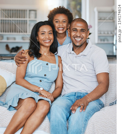Happy, black family and portrait of parents with son on sofa for bonding, quality time and relaxing at home. Love, living room and mother, father and child on couch with smile, hugging and happiness 134174614