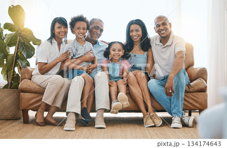 Portrait, big family and smile in home living room on sofa, bonding or having fun. Happiness, parents and grandparents with children in lounge, care and enjoying quality time together on house couch. 134174643