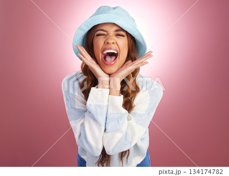 Portrait, surprise and woman excited, scream and cheerful against a studio background. Face, female and girl with excitement, happiness and celebration with emoji, facial expression and omg with wow 134174782