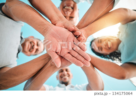 Happy family, trust and hands together below for teamwork, agreement or collaboration in solidarity. Group of people in community gathering piling hand for unity, celebration or love in partnership 134175064