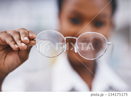 Vision, glasses in hand and woman in eye care clinic for health, wellness and poor sight exam with blur. Eyesight, girl holding designer brand frame and lens in hands, healthcare and test for eyes. Vision, glasses in hand and woman in eye care clinic for health, wellness and poor sight exam with blur. Eyesight, girl holding designer brand frame and lens in hands, healthcare and test for eyes. 134175175