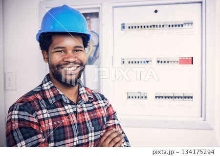 Black man in portrait, technician and electricity fuse box, check power supply with maintenance on main circuit breaker. Engineer, electrician and male worker with smile, handyman and electrical fix Black man in portrait, technician and electricity fuse box, check power supply with maintenance on main circuit breaker. Engineer, electrician and male worker with smile, handyman and electrical fix 134175294