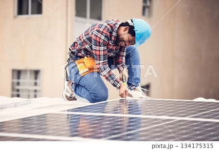 Solar panel install, engineer and black man on roof, sustainable or renewable energy mockup. Photovoltaic technician, electricity and happy person check, maintenance or inspection with screwdriver. 134175315