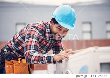 Man, measuring tape and air conditioner repair with inspection, installation or quality assurance on rooftop. African electrician, aircon and smile for maintenance, service check or hvac engineering Man, measuring tape and air conditioner repair with inspection, installation or quality assurance on rooftop. African electrician, aircon and smile for maintenance, service check or hvac engineering 134175346