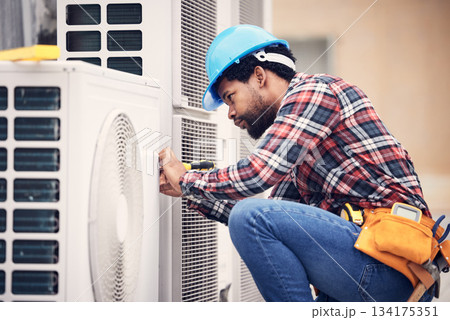 Black man, electrician and maintenance on air conditioner with engineering and handyman working with tools on roof. AC repair, professional male technician outdoor and power generator with service 134175351