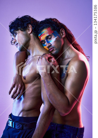 Friends, men and art model for beauty creativity with body paint as artwork isolated in a purple studio background. Colorful, embracing and creative people for artistic beauty, lgbt and fashion 134175386