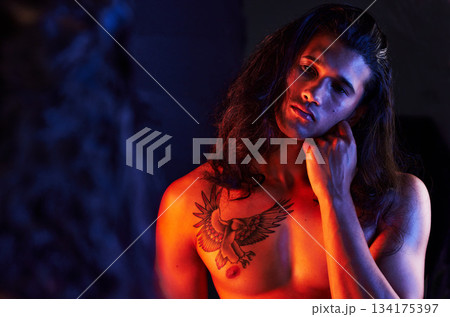Man, face and mirror reflection for beauty, art or self care of a person with hand on skin. Strong male model with a tattoo, glow and creative motivation or light for aesthetic backdrop 134175397