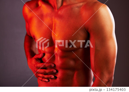 Fitness, neon and abdomen of man in studio for healthy body, muscles and self care on purple background. Creative aesthetic, glow and stomach of strong male model for exercise, wellness and skincare Fitness, neon and abdomen of man in studio for healthy body, muscles and self care on purple background. Creative aesthetic, glow and stomach of strong male model for exercise, wellness and skincare 134175403